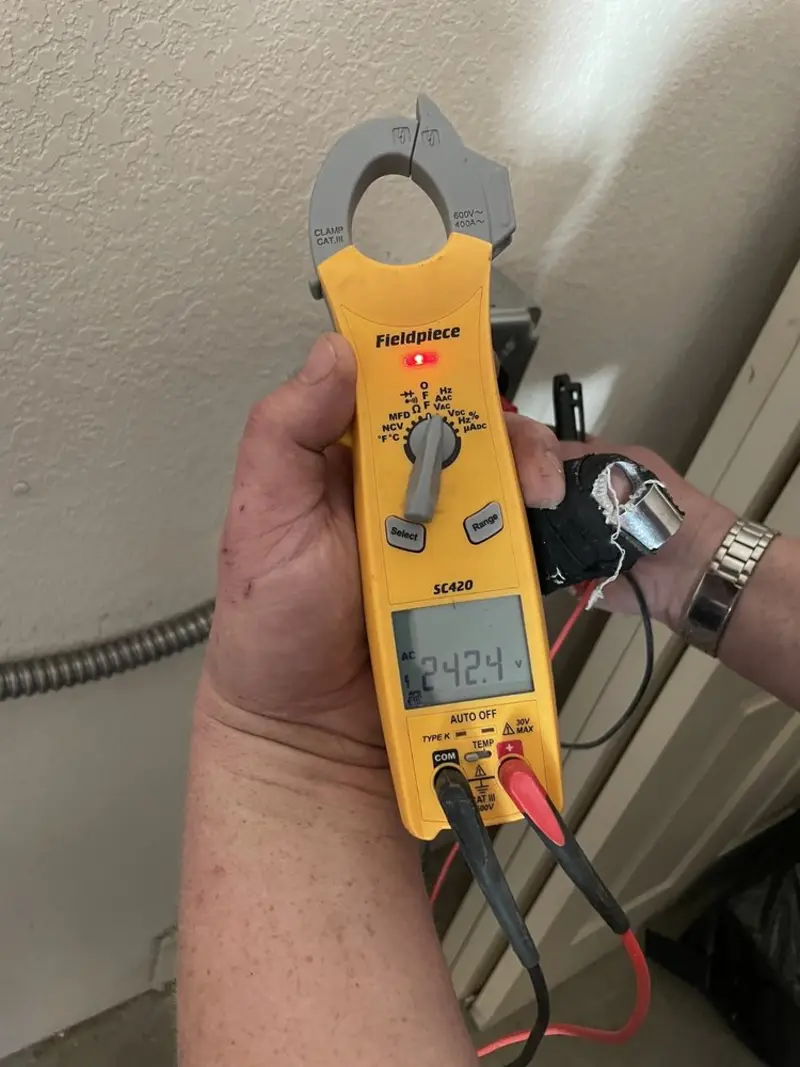 Voltage testing with clamp meter during Generator Installation in Bal Harbour